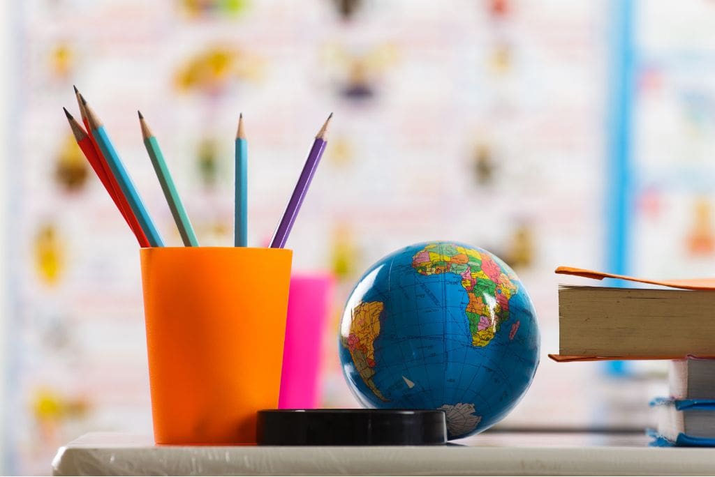 Educators Information Night. Classroom with pencils and a globe